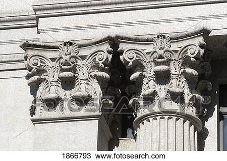 Stock Image - calgary, alberta, canada; detail on the columns of a building. Fotosearch