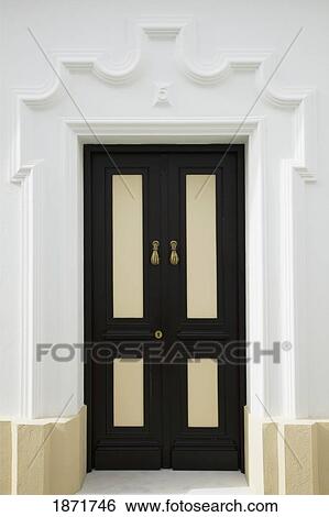 chiclana, andalusia, spain; a black door View Large Photo Image Stock Photograph - chiclana, andalusia, spain; a black door. Fotosearch