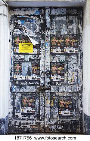 chiclana, andalusia, spain; an old door along the street covered in paper advertisements View Large Photo Image Stock Photograph - chiclana, andalusia, spain; an old door along the street covered in paper advertisements. Fotosearch