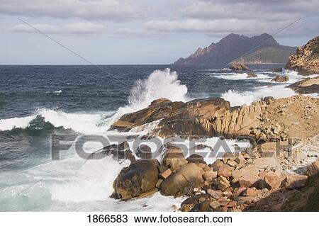 corsica, france; waves splashing on the coastline on the west coast View Large Photo Image Stock Image - corsica, france; waves splashing on the coastline on the west coast. Fotosearch