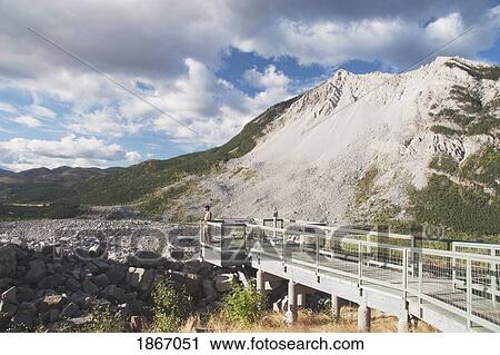Stock Image - crowsnest pass, alberta, canada; turtle mountain and frank slide with an observation deck. Fotosearch