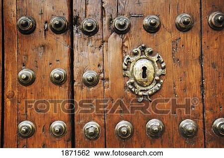 Stock Image - ecija, sevilla, spain; a keyhole in an old wooden door. Fotosearch