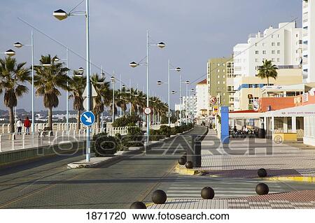 el puerto de santa maria, andalusia, spain; view of the city along city street View Large Photo Image Stock Image - el puerto de santa maria, andalusia, spain; view of the city along city street. Fotosearch