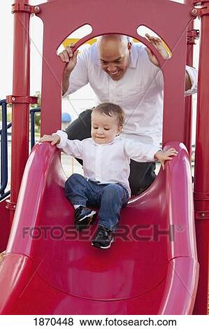 father and son playing at the playground View Large Photo Image Stock Photo - father and son playing at the playground. Fotosearch