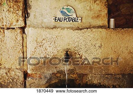 gourdon, provence, france; water tap with a sign saying 'eau potable' View Large Photo Image Stock Photo - gourdon, provence, france; water tap with a sign saying 'eau potable'. Fotosearch