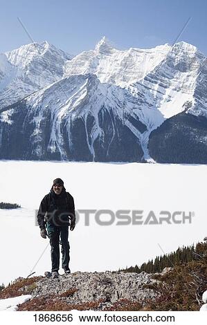 kananaskis country, alberta, canada; a male hiker in winter with snow-covered mountains and upper kananaskis lake View Large Photo Image Stock Photograph - kananaskis country, alberta, canada; a male hiker in winter with snow-covered mountains and upper kananaskis lake. Fotosearch