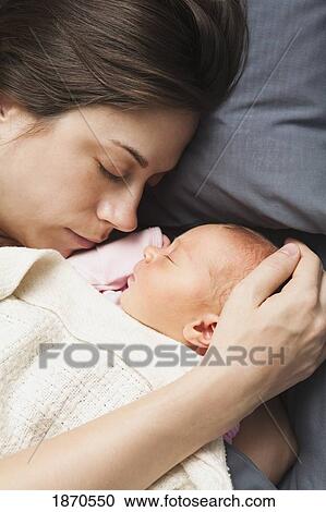 nashville, tennessee, united states of america; a mother sleeping with her newborn View Large Photo Image Stock Image - nashville, tennessee, united states of america; a mother sleeping with her newborn. Fotosearch