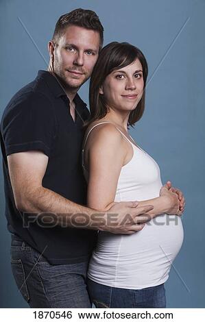 nashville, tennessee, united states of america; a man embracing a pregnant woman from behind her View Large Photo Image Stock Photograph - nashville, tennessee, united states of america; a man embracing a pregnant woman from behind her. Fotosearch