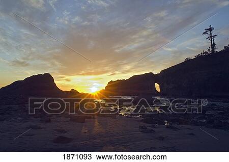 olympic national park, washington, united states of america; sunset arch and the sun setting over second beach View Large Photo Image Stock Image - olympic national park, washington, united states of america; sunset arch and the sun setting over second beach. Fotosearch