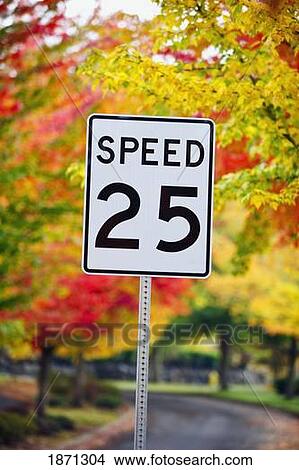 Picture - oregon, united states of america; a speed limit sign on the side of the road in autumn. Fotosearch