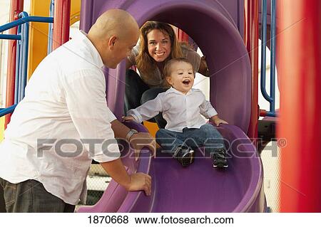 parents playing with young son at the playground View Large Photo Image Stock Photo - parents playing with young son at the playground. Fotosearch