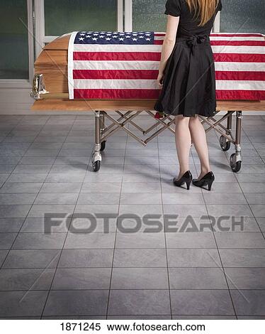 paying respects to the deceased with an american flag draped over the coffin View Large Photo Image Stock Photography - paying respects to the deceased with an american flag draped over the coffin. Fotosearch