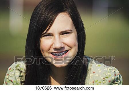 portrait of a girl with braces View Large Photo Image Stock Photograph - portrait of a girl with braces. Fotosearch