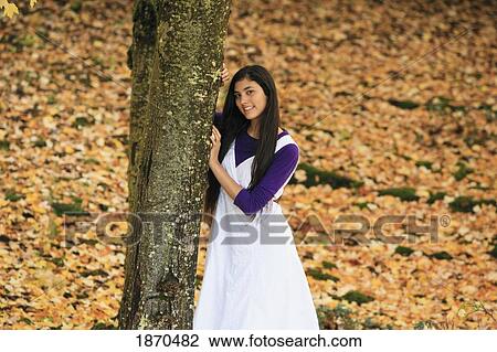 Stock Image - portrait of a teenage girl in autumn. Fotosearch