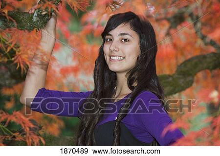 Stock Photo - portrait of a teenage girl in autumn. Fotosearch