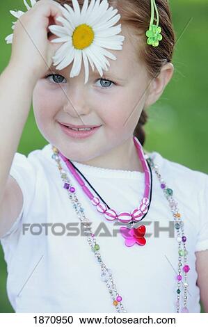 portrait of a young girl holding a daisy View Large Photo Image Stock Image - portrait of a young girl holding a daisy. Fotosearch