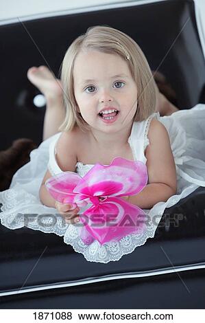portrait of a young girl wearing a white dress View Large Photo Image Stock Photo - portrait of a young girl wearing a white dress. Fotosearch