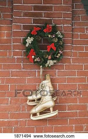 skates hanging from a wreath View Large Photo Image Picture - skates hanging from a wreath. Fotosearch