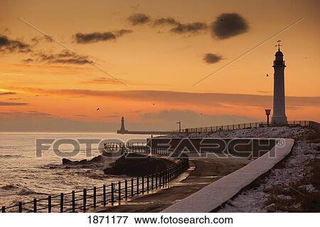 Stock Photo - sunderland, tyne and wear, england; a lighthouse along the coast in the winter. Fotosearch