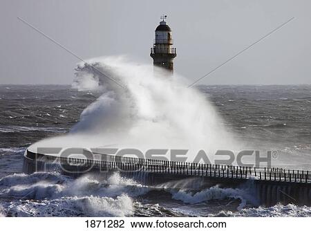 sunderland, tyne and wear, england; waves crashing into a pier and lighthouse View Large Photo Image Stock Image - sunderland, tyne and wear, england; waves crashing into a pier and lighthouse. Fotosearch