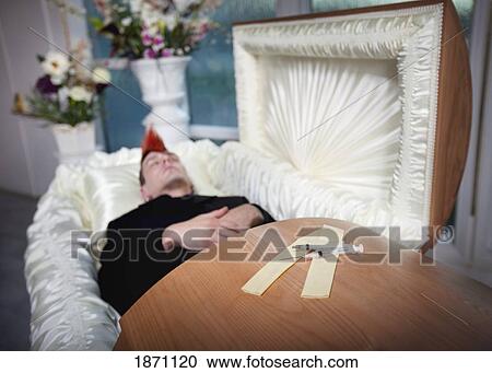 the coffin of a young man with syringes on top of it View Large Photo Image Stock Image - the coffin of a young man with syringes on top of it. Fotosearch