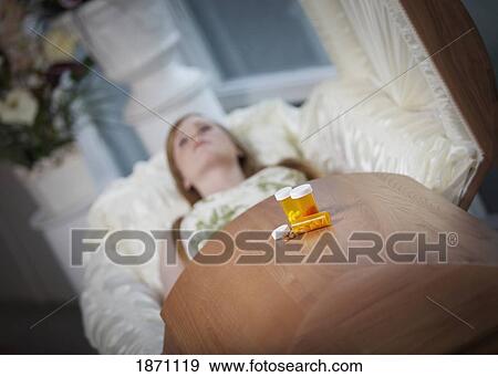 the coffin of a young woman with medication bottles on top View Large Photo Image Stock Photo - the coffin of a young woman with medication bottles on top. Fotosearch