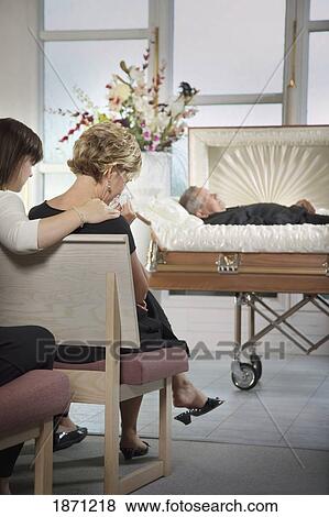 the deceased laying in a coffin at a funeral View Large Photo Image Stock Photo - the deceased laying in a coffin at a funeral. Fotosearch