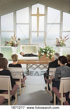 the deceased laying in a coffin at his funeral View Large Photo Image Stock Photo - the deceased laying in a coffin at his funeral. Fotosearch