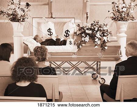 the deceased laying in a coffin at his funeral with bags of money surrounding him View Large Photo Image Stock Photography - the deceased laying in a coffin at his funeral with bags of money surrounding him. Fotosearch
