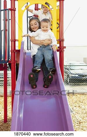 three children playing at the playground View Large Photo Image Stock Image - three children playing at the playground. Fotosearch