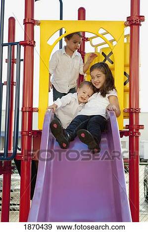 three children playing at the playground View Large Photo Image Stock Photo - three children playing at the playground. Fotosearch