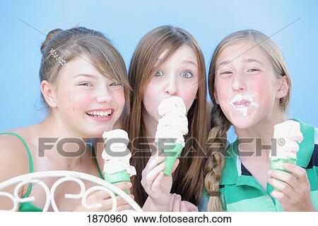 three girls eating ice cream cones View Large Photo Image Stock Image - three girls eating ice cream cones. Fotosearch