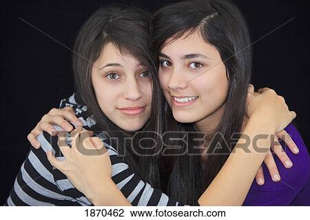 two teenage girls in an embrace View Large Photo Image Stock Image - two teenage girls in an embrace. Fotosearch