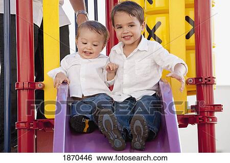 Stock Photograph - two young boys at the playground. Fotosearch