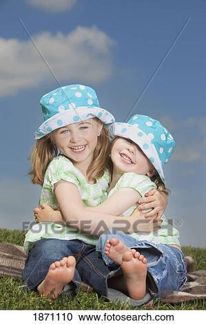 two young girls hugging View Large Photo Image Stock Image - two young girls hugging. Fotosearch