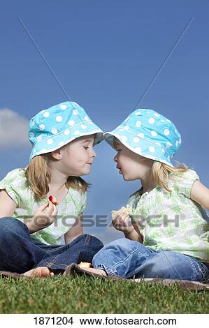 two young girls with matching hats View Large Photo Image Picture - two young girls with matching hats. Fotosearch
