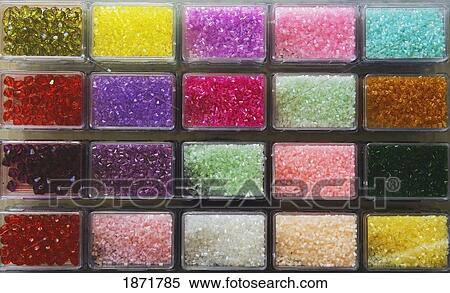 various beads in their compartments through the glass View Large Photo Image Stock Photography - various beads in their compartments through the glass. Fotosearch