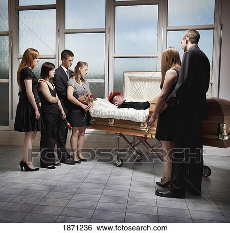 Stock Photograph - viewing a deceased loved one in a coffin. Fotosearch