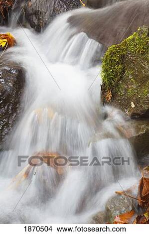 waterfall over rocks in autumn View Large Photo Image Picture - waterfall over rocks in autumn. Fotosearch