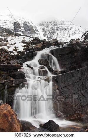 yoho national park, british columbia, canada; waterfalls and snow covered mountains View Large Photo Image Stock Photography - yoho national park, british columbia, canada; waterfalls and snow covered mountains. Fotosearch