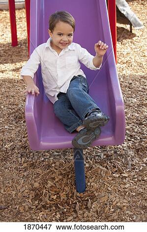 young boy playing at the playground View Large Photo Image Stock Photo - young boy playing at the playground. Fotosearch