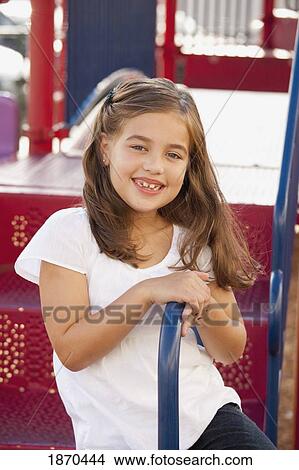 young girl playing at the playground View Large Photo Image Picture - young girl playing at the playground. Fotosearch