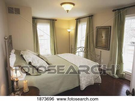 a bedroom with large windows View Large Photo Image Stock Photograph - a bedroom with large windows. Fotosearch