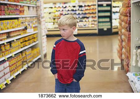 a boy in a grocery store View Large Photo Image Stock Image - a boy in a grocery store. Fotosearch