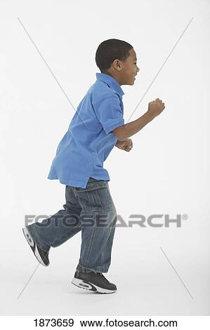 a boy posed as a runner View Large Photo Image Stock Photo - a boy posed as a runner. Fotosearch