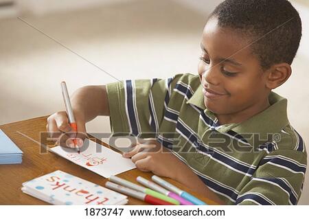 a boy writing thank you cards View Large Photo Image Stock Photo - a boy writing thank you cards. Fotosearch
