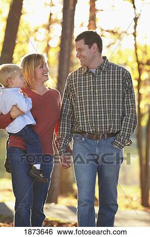 Stock Photograph - a family walk in autumn. Fotosearch
