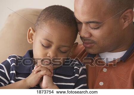 a father and son praying together View Large Photo Image Picture - a father and son praying together. Fotosearch