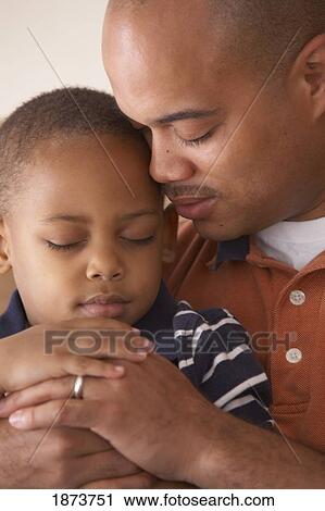 a father and son praying together View Large Photo Image Stock Image - a father and son praying together. Fotosearch