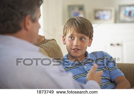a father and son talking together View Large Photo Image Stock Photo - a father and son talking together. Fotosearch